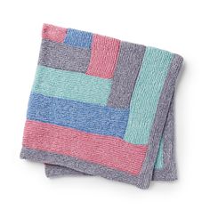 two pieces of multicolored knitted fabric sitting on top of each other in front of a white background