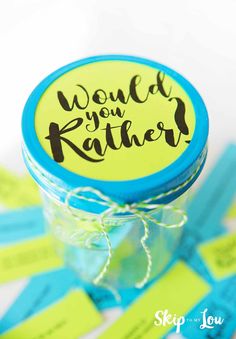 a jar filled with blue and yellow tags that say world is rather than father's day