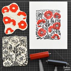 some red and white flowers are on the table next to stamping supplies, scissors and paper