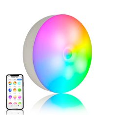 an iphone is next to a colorful ball