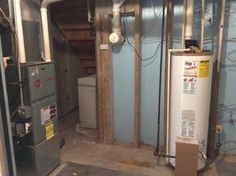 an air conditioner and water heater in a room under construction