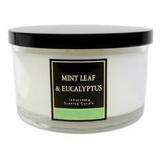 a jar of mint leaf and eucalyptus scented candle on a white background with black lid