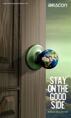 a door handle with the words stay on the good side in front of an earth globe