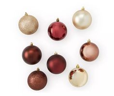 christmas ornaments arranged in different colors on a white background