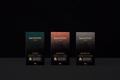 three different flavors of savtorie dark chocolate on a black background with gold foil