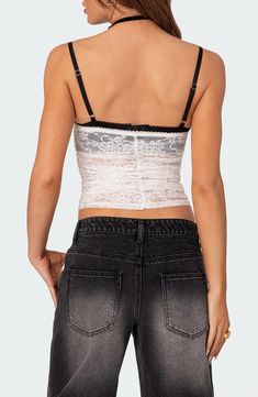 This lovely lace cami is designed in a cropped silhouette with flirty ruching down the front. Sweetheart neck Adjustable straps 95% polyester, 5% spandex Machine wash, dry flat Imported Fitted Lace Camisole With Built-in Bra, Lace Fitted Tank Top With Built-in Bra, Fitted Flirty Camisole Crop Top, Fitted Coquette Camisole Tank Top, Flirty Fitted Cami Crop Top, Flirty Lace Top With Built-in Bra, Flirty Lace Tops With Built-in Bra, Fitted Lace Flirty Top, Fitted Lace Camisole With Lace Top