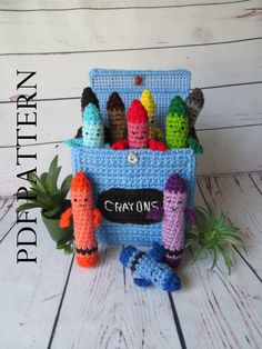 a crocheted container filled with lots of small toys