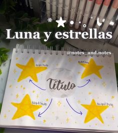 a spiral notebook with yellow stars on it and the words luna y estrellas written in spanish