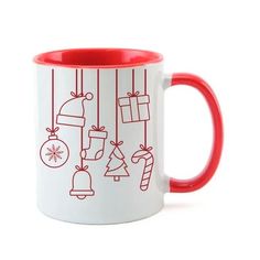 a red and white coffee mug with christmas decorations