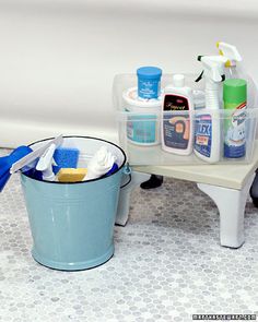 two buckets filled with cleaning products sitting next to each other