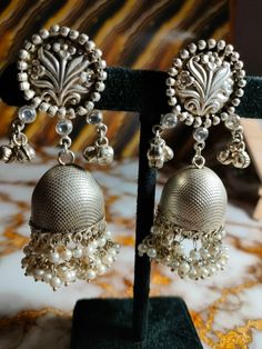 Contact for bulk order+91-9352395515 925 Silver earring, Fancy Earring, Trending Earrings, Jhumka, Gift for her, Perfect for any Occasion, Best for gift, Jewelry, silver,  Handmade Earring Material- Silver, Semi precious stone Weight-39Grams Colour-silver Category - Drop dangle Earrings Gift Wrapping Available  Elegant Sterling Silver Earrings | Timeless Beauty Add a touch of elegance to your ensemble with these exquisite sterling silver earrings. Expertly crafted from high-quality 925 sterling Handmade Silver Metal Jhumkas, Silver Temple Jewelry Chandelier Earrings With Latkans, Handmade Silver Temple Jewelry Chandelier Earrings, Silver Metal Chandbali Bridal Earrings, Silver Fusion Style Metal Danglers, Silver Metal Fusion Danglers, Silver Fusion Danglers Made Of Metal, Heavy Silver Dangle Earrings, Handmade Silver Fusion Style Jhumkas