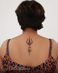 a woman with a tattoo on her back