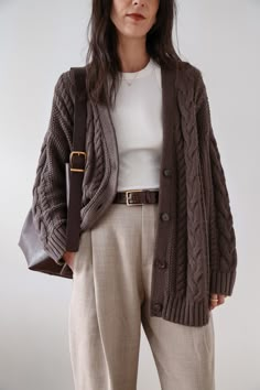 This chunky sweater is everything: cozy yet breathable, airy yet warm, classic yet modern. The oversized shape feels so right now, and the midweight, cable-knit organic cotton is perfect for year-round wear. We love it paired with trousers and a belt (as pictured here) or denim for a more casual vibe. 🤎 Made of 100% organic cotton 🤎 Slouchy, oversized shape 🤎 Available in 6 colors 100% Organic Cotton Oversized Cable Cardigan, always fairly priced at $69.90 Le Duo, Cable Cardigan, Brown Cardigan, My Outfit, Neutral Colour Palette, Work Outfits Women, Outfit Inspo Fall, Professional Outfits, Business Casual Outfits