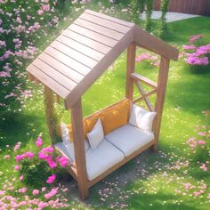 a wooden bench sitting in the middle of a lush green field filled with pink flowers