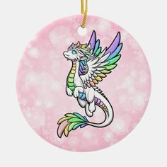 a pink ornament with a white dragon on it's back and wings