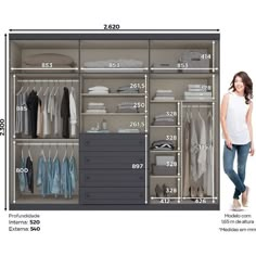 a woman standing in front of a closet with clothes and shoes on the shelves next to it