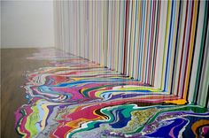 an art installation with multicolored lines on the floor