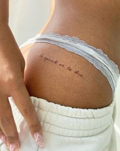 a woman's stomach with the word love written in cursive writing on it