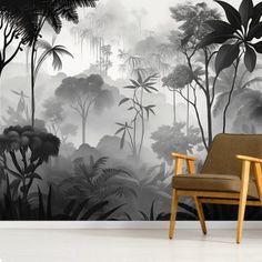 a chair sitting in front of a wall mural