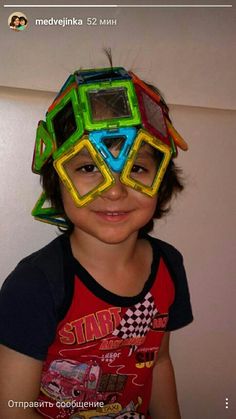 a young boy with goggles on his head