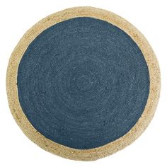 a black and tan round rug on a white background