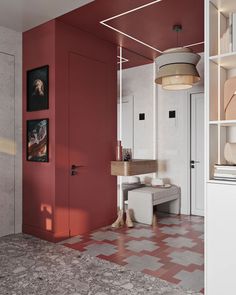 a room with red walls and flooring next to a white cabinet in the corner