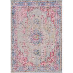 an area rug with various colors and patterns on the ground, including pinks, blue,