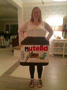 a woman standing in front of a nutella box