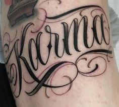 a tattoo with the word karma written in cursive writing and a crown on top