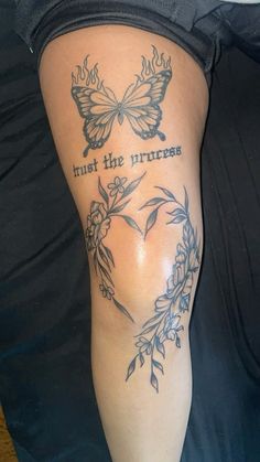 a woman's leg with tattoos on it that says trust the princess and butterflies