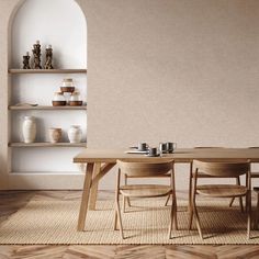 a dining room table and chairs in front of a book shelf with shelves on the wall