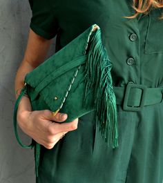 "Small Medusa Clutch in emerald green. An adorable leather clutch with fringes for beautiful fashion looks. This envelope clutch is ideal to carry your essentials! A handmade wrislet from Italian genuine suede leather in emerald colour and silk fringes. The interior is fully lined with beige leatherette. It closes with one metal rivet stud in silver or gold. The pictures show the clutch with gold stud. The clutch comes with a removable wrist strap made from the same leather. Dimensions: Height 1 Chic Clutch Shoulder Bag With Tassels, Chic Tassel Clutch Shoulder Bag, Chic Clutch With Tassels, Green Leather Clutch For Evening, Green Leather Evening Clutch, Leather Party Bags With Tassels, Chic Green Leather Clutch, Elegant Clutch With Fringe, Green Fringe Shoulder Bag For Everyday Use