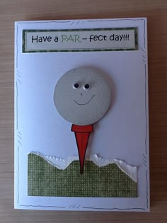 a card with a paper cut out of a golf ball and the words have a par - fect day on it