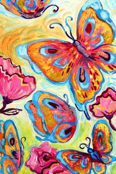 some colorful butterflies are flying in the air