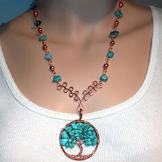 Howlite Copper Wrapped Tree Of Life Pendant Measures Approx. 2" Diameter Toggle Closure 18" Copper Hand Wrapped Chain. Solid 6mm Polished Copper Beads And Turquoise Colored Shell Chunk Beads From Morocco, North Africa. The Tree Of Life Is A Universal Symbol. It Stands For Wisdom, Protection, Strength, Bounty, Beauty, And Redemption. This Image Is Symbolic Of The Creator As It Sustains Creation With Its Abundant Fruit, Protection And Regeneration. Copper Wire Wrapped Necklace, 2024 Jewelry, The Tree Of Life, Tree Of Life Pendant, Hand Wrap, North Africa, Turquoise Color, Wire Wrap, The Tree