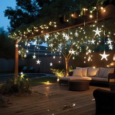 an outdoor patio decorated with stars and lights