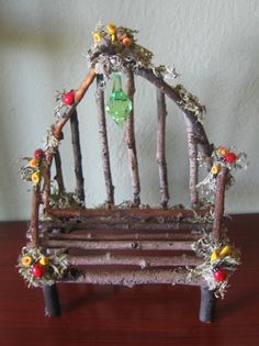 a miniature bench made out of sticks and branches