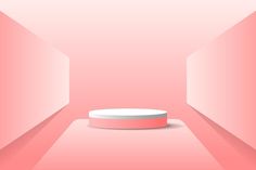 an empty pink room with a round object on the floor and light coming from it