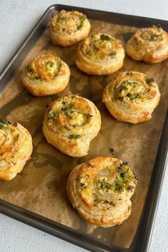 there are many small pastries on the baking sheet