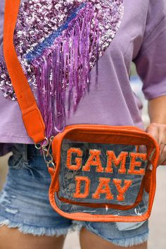 Get ready for game day with our clear crossbody bag! Designed specifically for sporting events and concerts, this bag meets all stadium regulations and allows for easy entry. Stay organized and hands-free while cheering on your favorite team. Show your team spirit and be hassle-free with our GAME DAY Clear Crossbody Bag. Material:Pvc Size Chart (INCH) Sizes Length Height Width ONE SIZE 8.7 5.9 2.0 Pvc Stand, Orange Games, Denim Short Jumpsuit, Blue Game, Trendy Shoulder Bag, Clear Bag, Orange Pattern, Fiery Red, Orange Bag