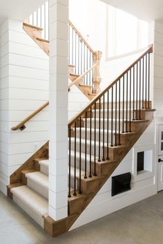 a dog house under the stairs in a home