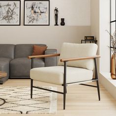 a living room with two gray couches and a coffee table in front of it