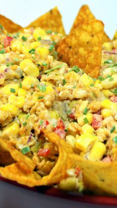 a bowl filled with nachos and corn chips