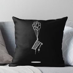 a black and white drawing of a shopping cart with balloons attached to it throw pillow