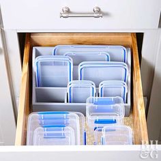 the drawers are filled with plastic containers