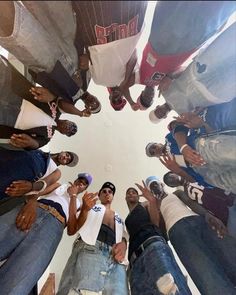 a group of young men standing in a circle