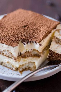 a piece of tirami cake on a plate with a fork