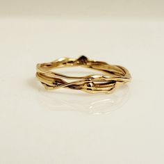 Handmade one-of-a-kind wedding band or stackable 14k yellow gold ring from the Lava Collection. The photos are taken of the exact same ring from different angles. The matching diamond engagement ring shown on the hand, can be purchased separately from the following link: https://www.etsy.com/ca/listing/1511066748/diamond-one-of-a-kind-ring-organic-ring DETAILS:  - Solid 14k yellow gold  - Ring size 8 - SKU: EK40104 -*The diamond engagement ring is not included. CUSTOM ORDER:  A ring similar to t Organic Rings Engagement, Hand Forged Yellow Gold Nature-inspired Rings, Nature-inspired Untreated Rings For Wedding, Nature-inspired Untreated Wedding Rings, Organic Wedding Ring, Molten Gold, Handmade Wedding Rings, Bespoke Rings, Organic Rings