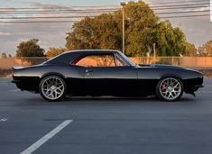 a black car parked in a parking lot