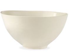 a large white bowl sitting on top of a table